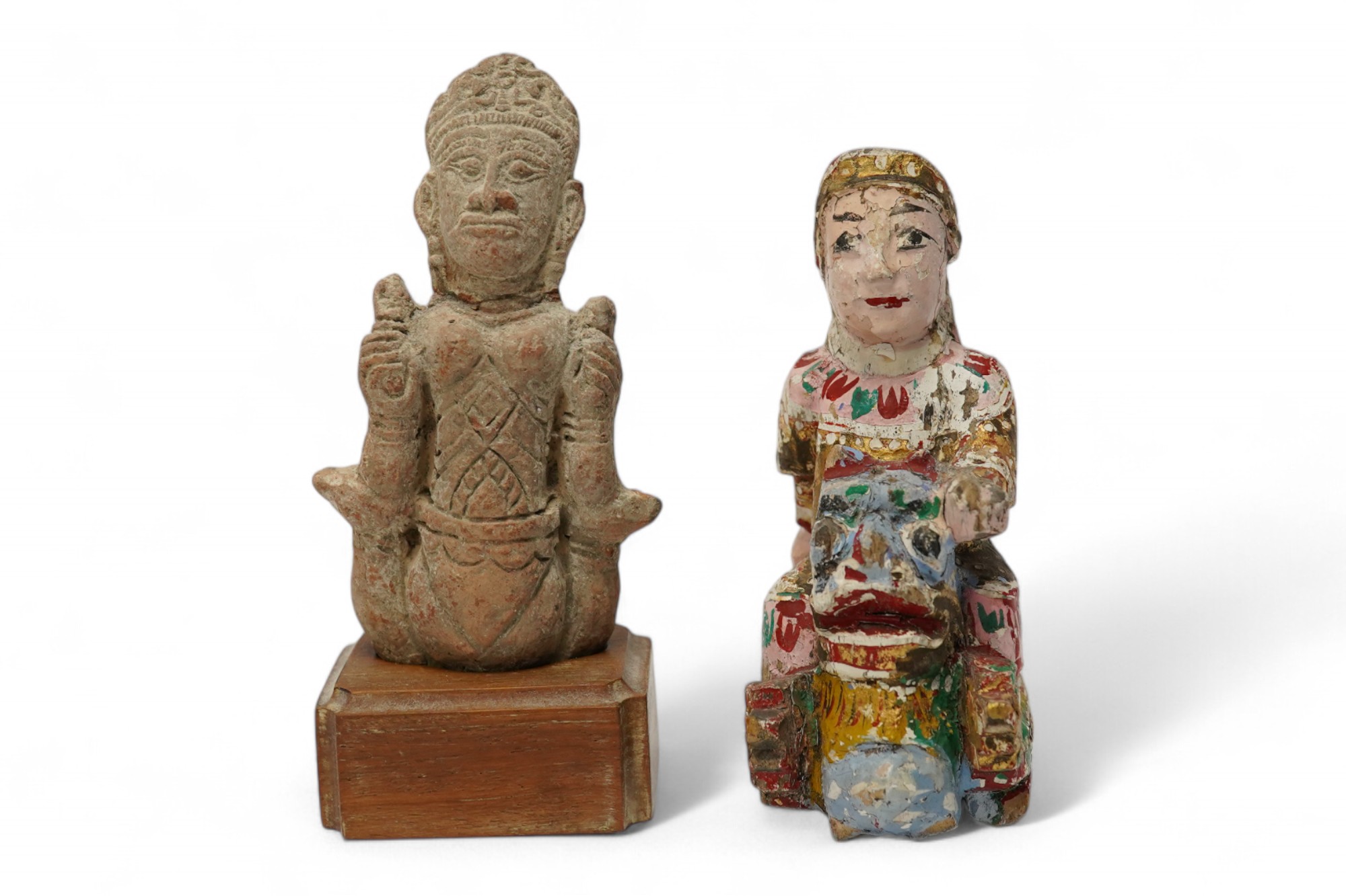 A Burmese lacquered wood figure, 19th century and an Indian terracotta figure of a deity, largest 13cm high overall. Condition - fair